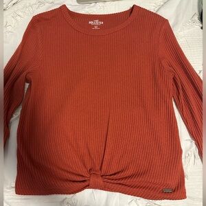 Hollister red/orange sweater. Size medium.